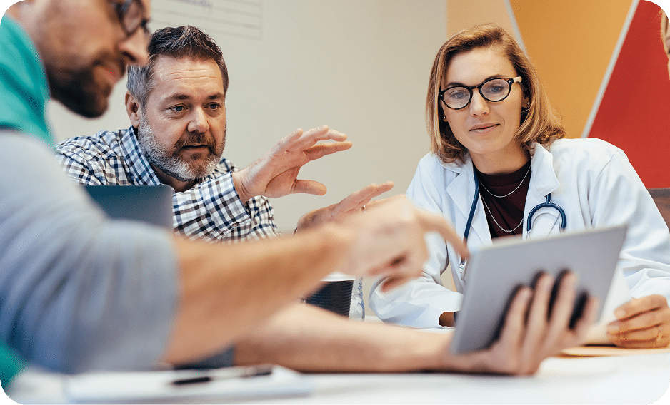 Patient in consultation with two clinicians